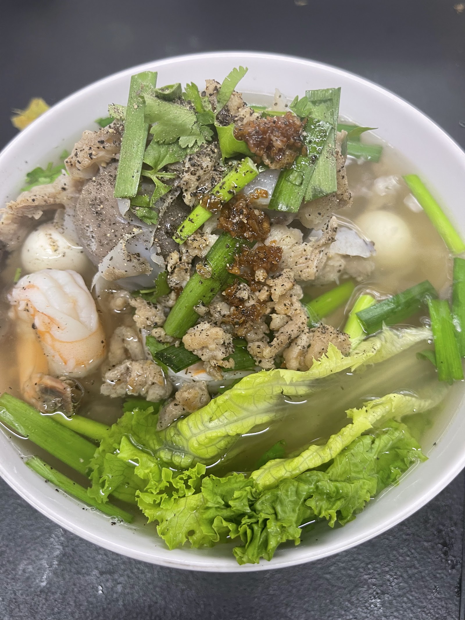 Bánh canh cua crab noodle soup with shrimp and lettuce